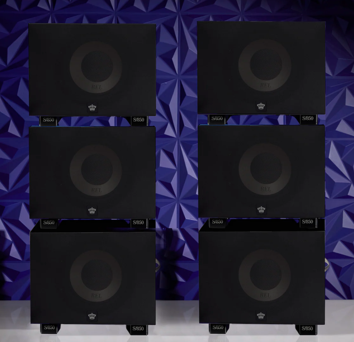 REL S/850 Subwoofer in black, scaled up to six, with grille