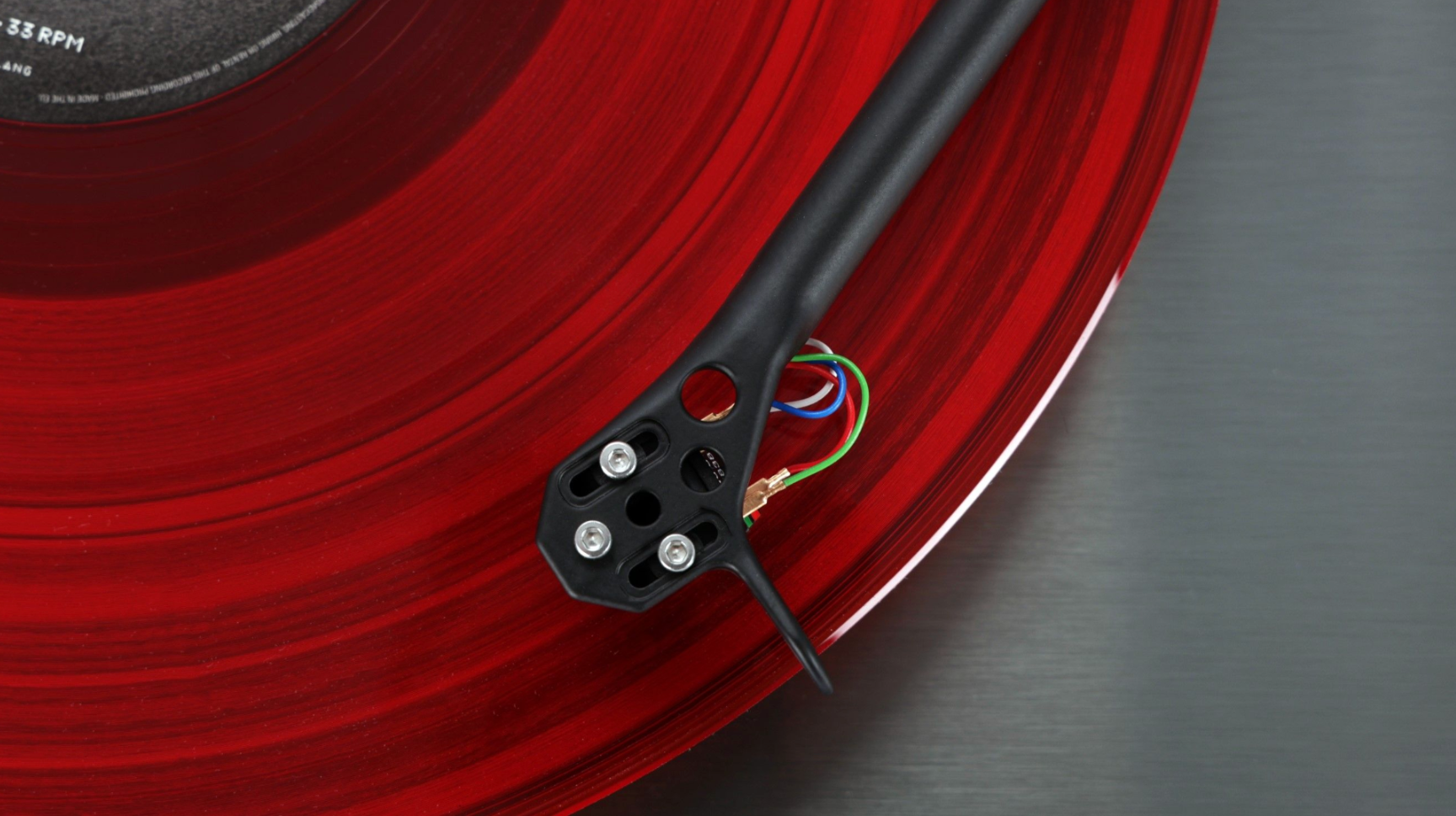 Rega Planar 3 RS Special Edition with ND5 in Brushed Aluminium Black without dustcover. Closeup of cartridge on disc