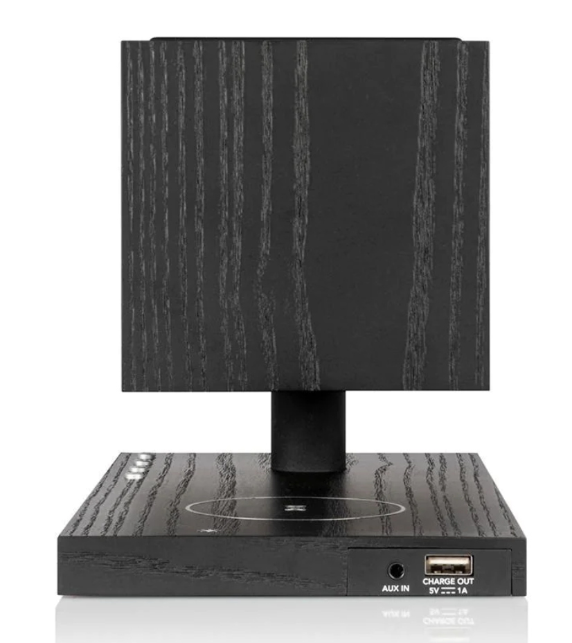 The Tivoli Audio Revive compact speaker delivers powerful sound while recharging your devices wirelessly. Black side image