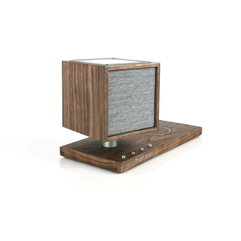 The Tivoli Audio Revive compact speaker delivers powerful sound while recharging your devices wirelessly. Walnut side image