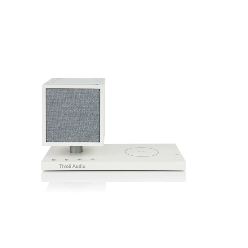 The Tivoli Audio Revive compact speaker delivers powerful sound while recharging your devices wirelessly. White image