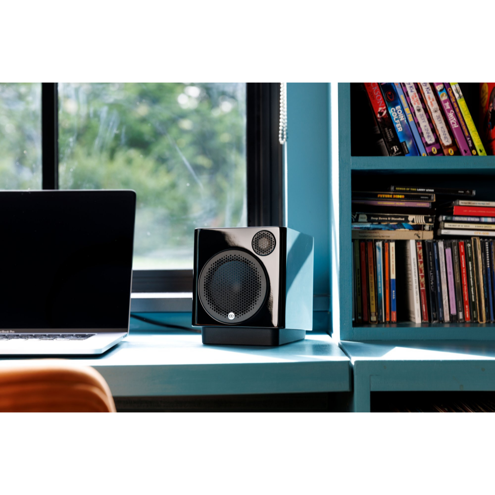 Monitor Audio Radius Desk Pad 4G Isolation Platform shown with Monitor Audio Radius 1 4G Speaker in Gloss Black on desk