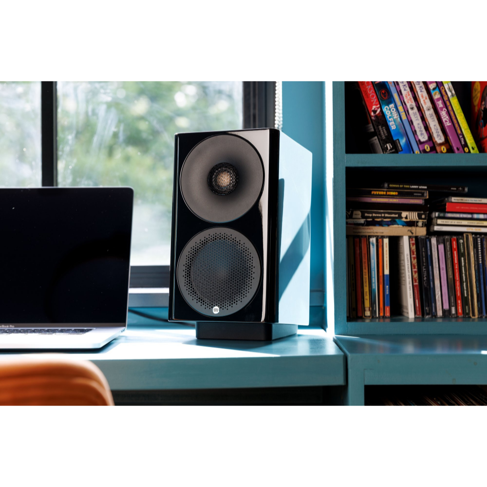 Monitor Audio Radius Desk Pad 4G Isolation Platform shown with Monitor Audio Radius 3 4G Speaker in Gloss Black on desk