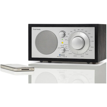 The iconic Model One BT radio delivers timeless style and exceptional sound, with Bluetooth connectivity. Black/Sliver image with phone