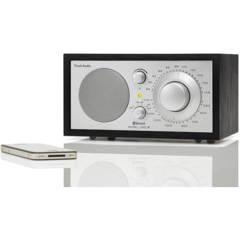 The iconic Model One BT radio delivers timeless style and exceptional sound, with Bluetooth connectivity. Black/Sliver image with phone