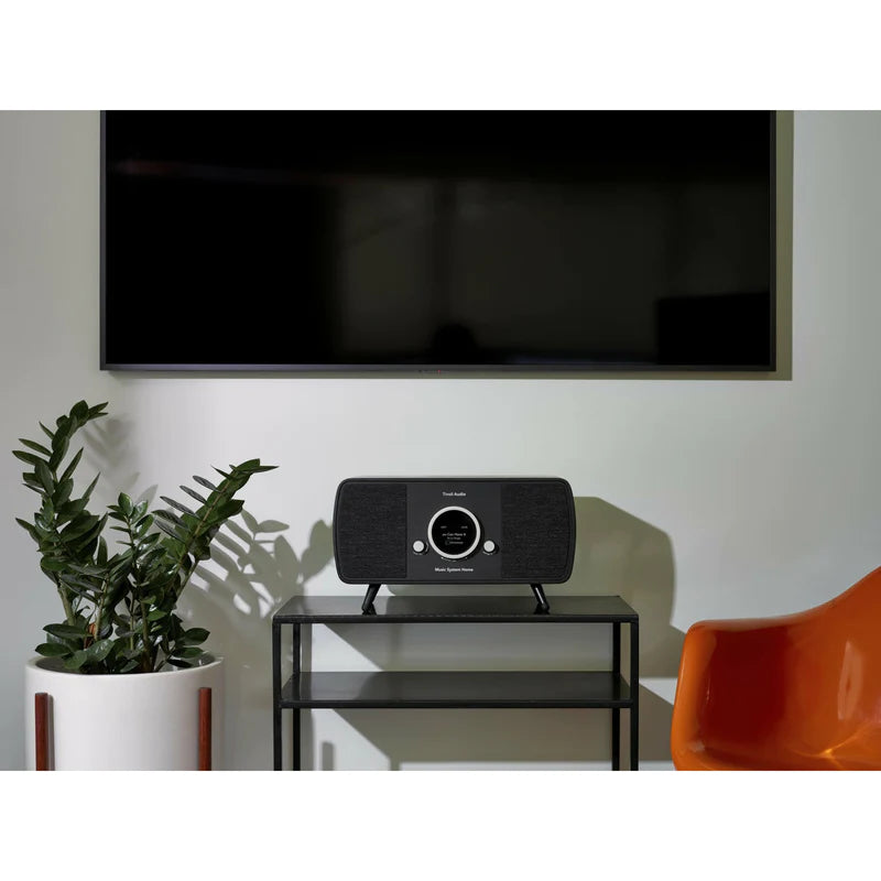 The Tivoli Audio Music System Home (Gen. 2) is the pinnacle of audio innovation.  Black living room image