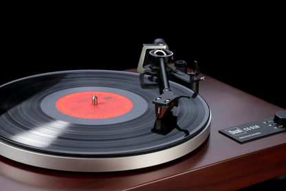 Dual CS-518 Manual Turntable in Walnut showing Ortofon Red playing on vinyl