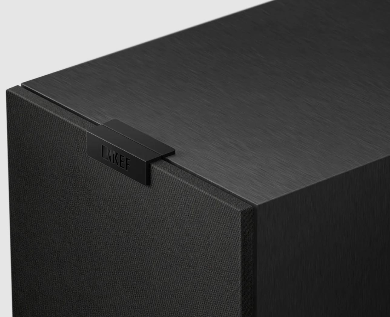 KEF Q1 Meta Compact 2-way Bookshelf Speakers in Satin Black.  Image shows grille closure