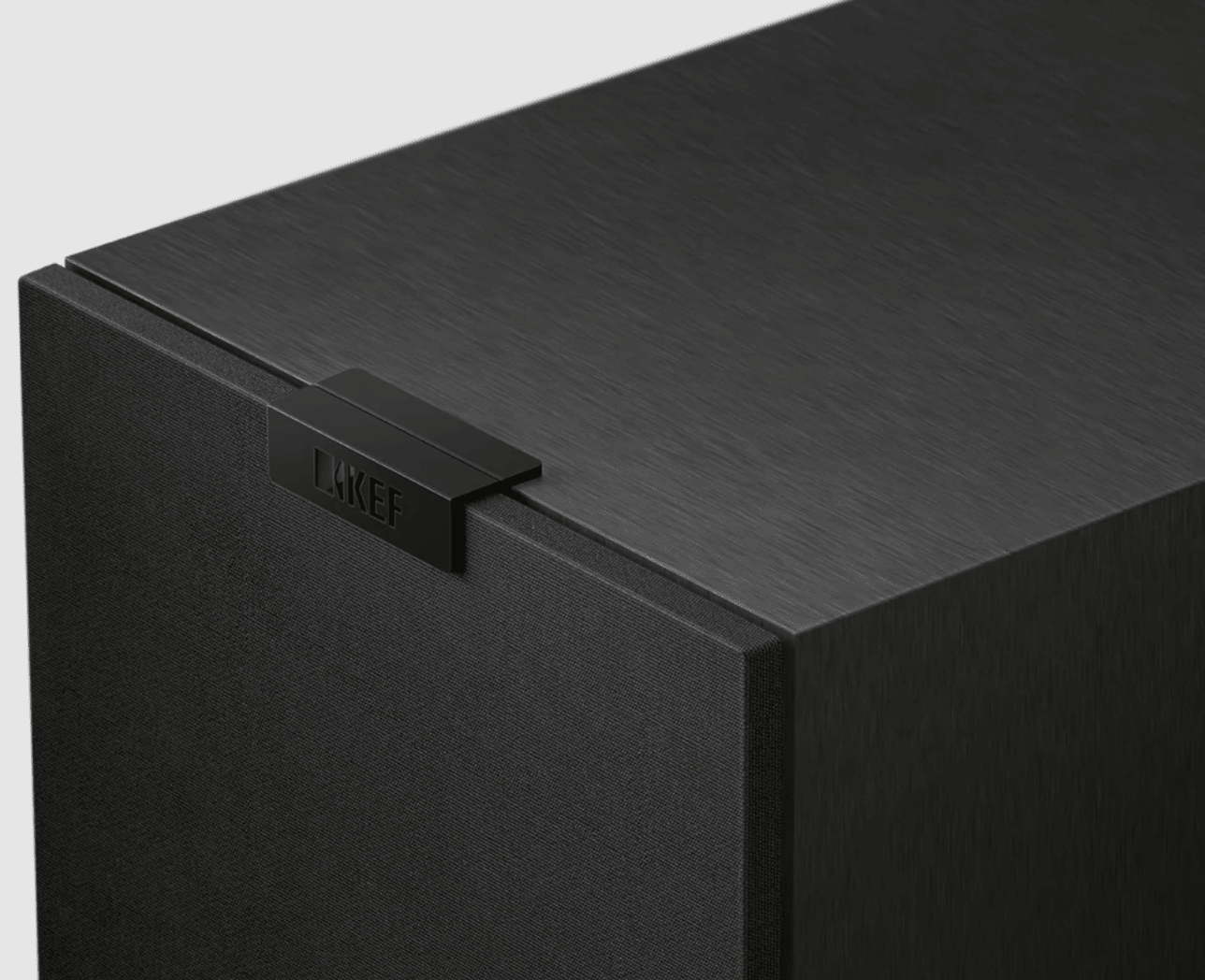 KEF Q1 Meta Compact 2-way Bookshelf Speakers in Satin Black.  Image shows grille closure