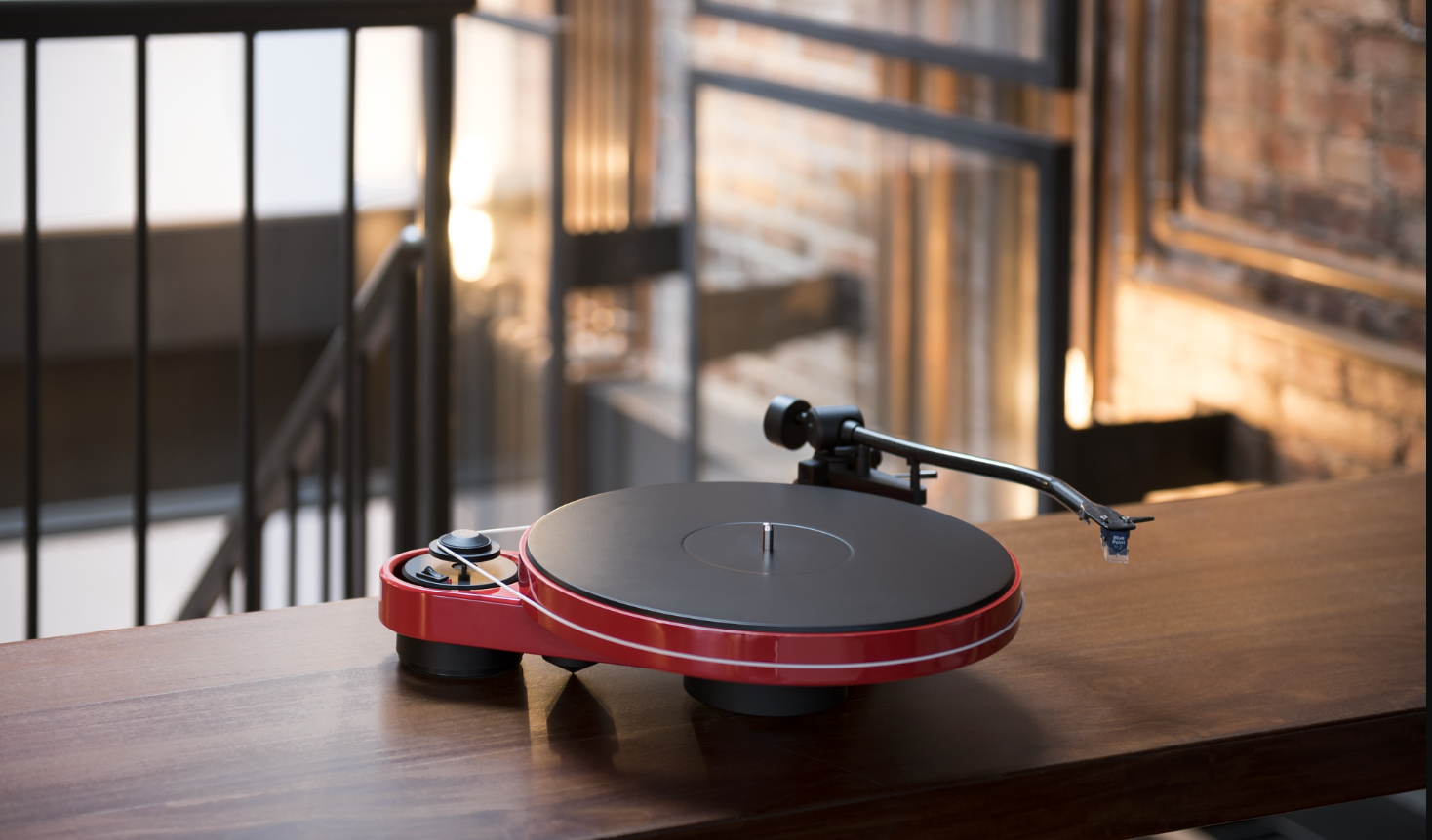 ProJect RPM 3 Carbon Turntable with Ortofon 2M Silver Cartridge, red lifestyle image