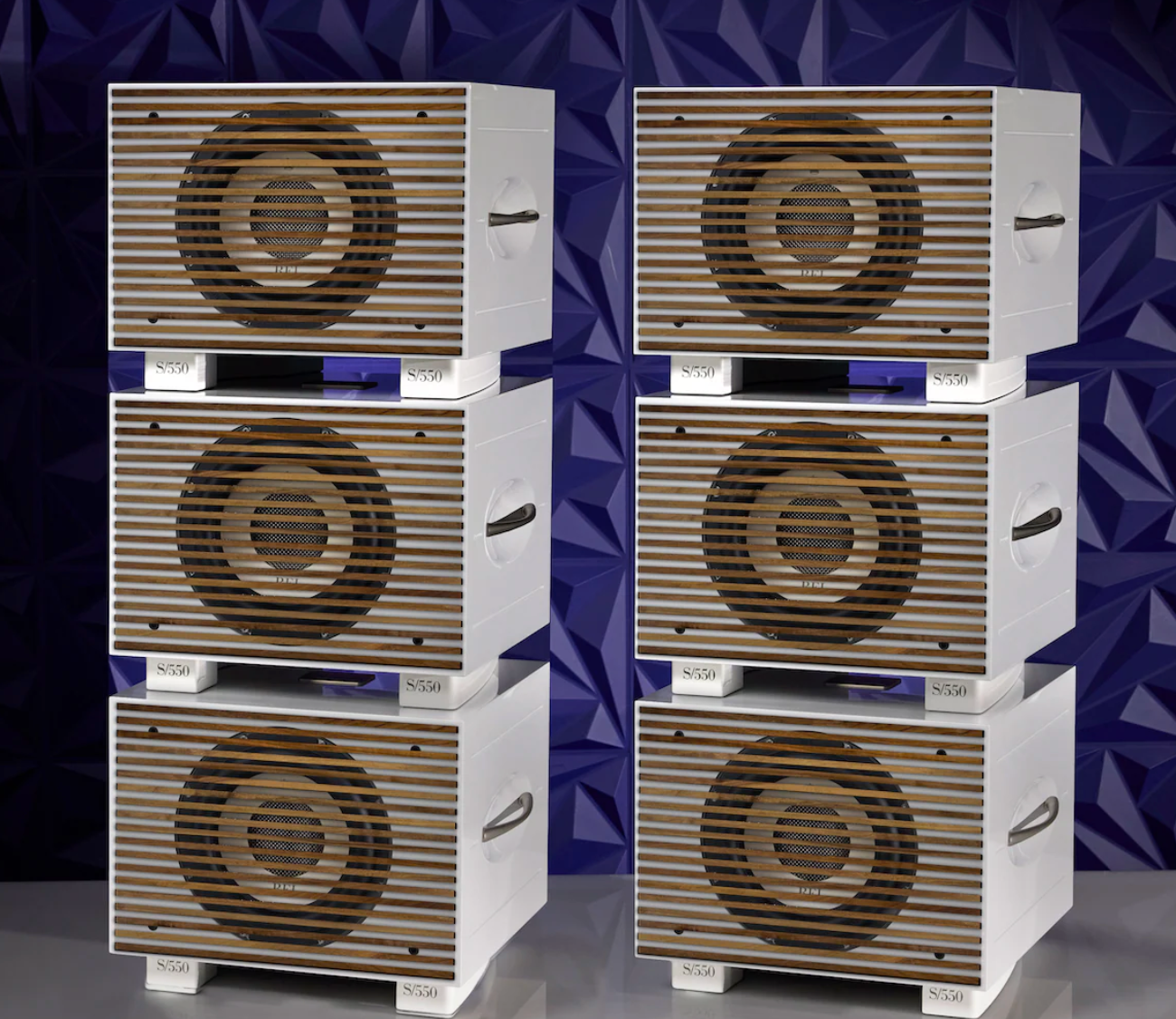 REL S/550 Subwoofers, stacked in White with wooden grille