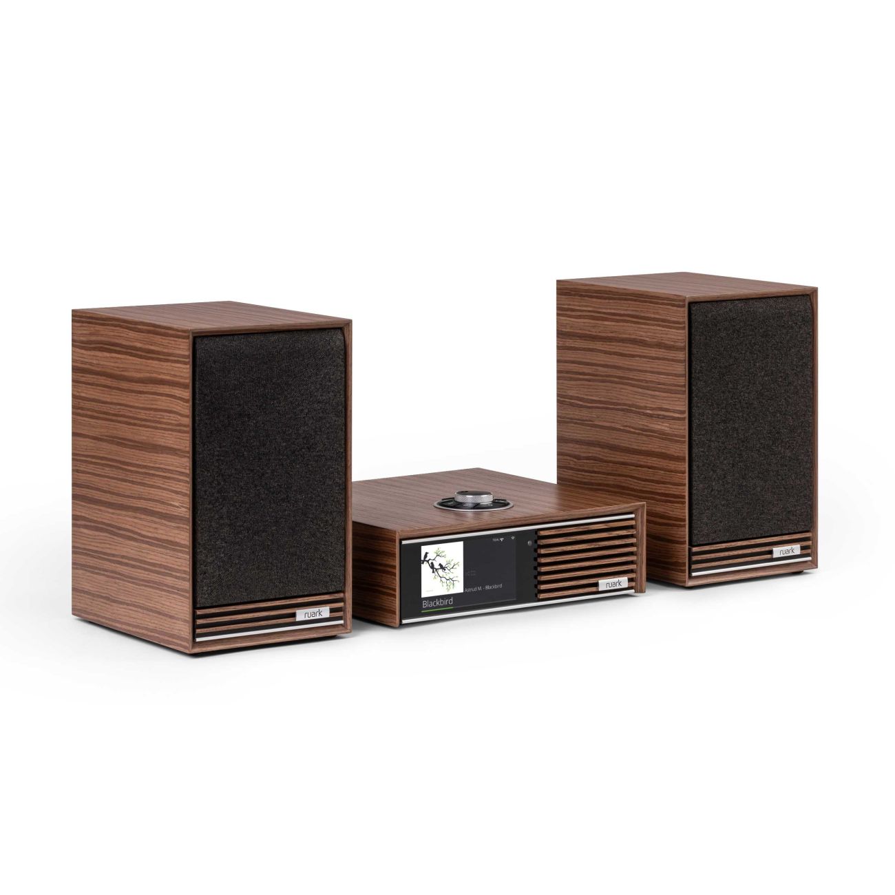 Ruark Audio R610 and Sabre-R Streaming System in fused Walnut, angled view, with grille on speakers