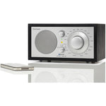The iconic Model One BT radio delivers timeless style and exceptional sound, with Bluetooth connectivity. Black/Sliver image with phone